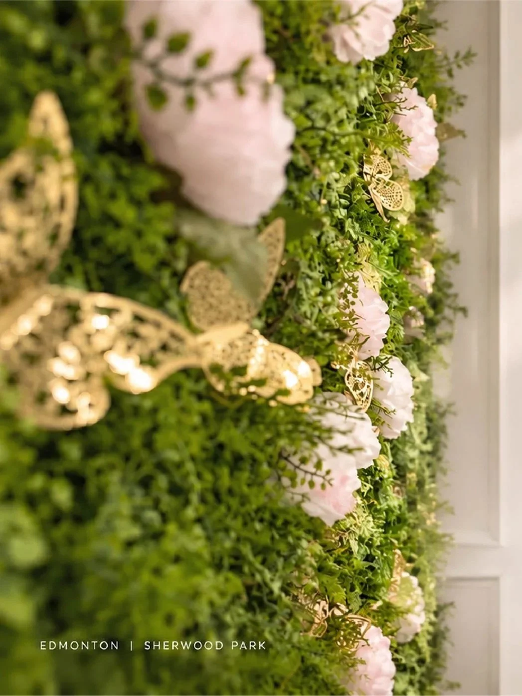 Flowers and gold butterfly details at Adore Beauté